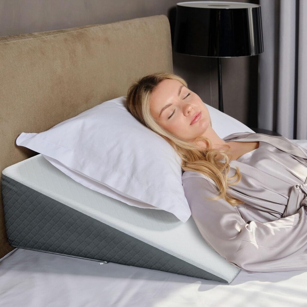 Kolbs Bed Wedge pillow with a stylish jacquard cover placed on a neatly made bed, showing its angled design that supports elevated sleep comfort.